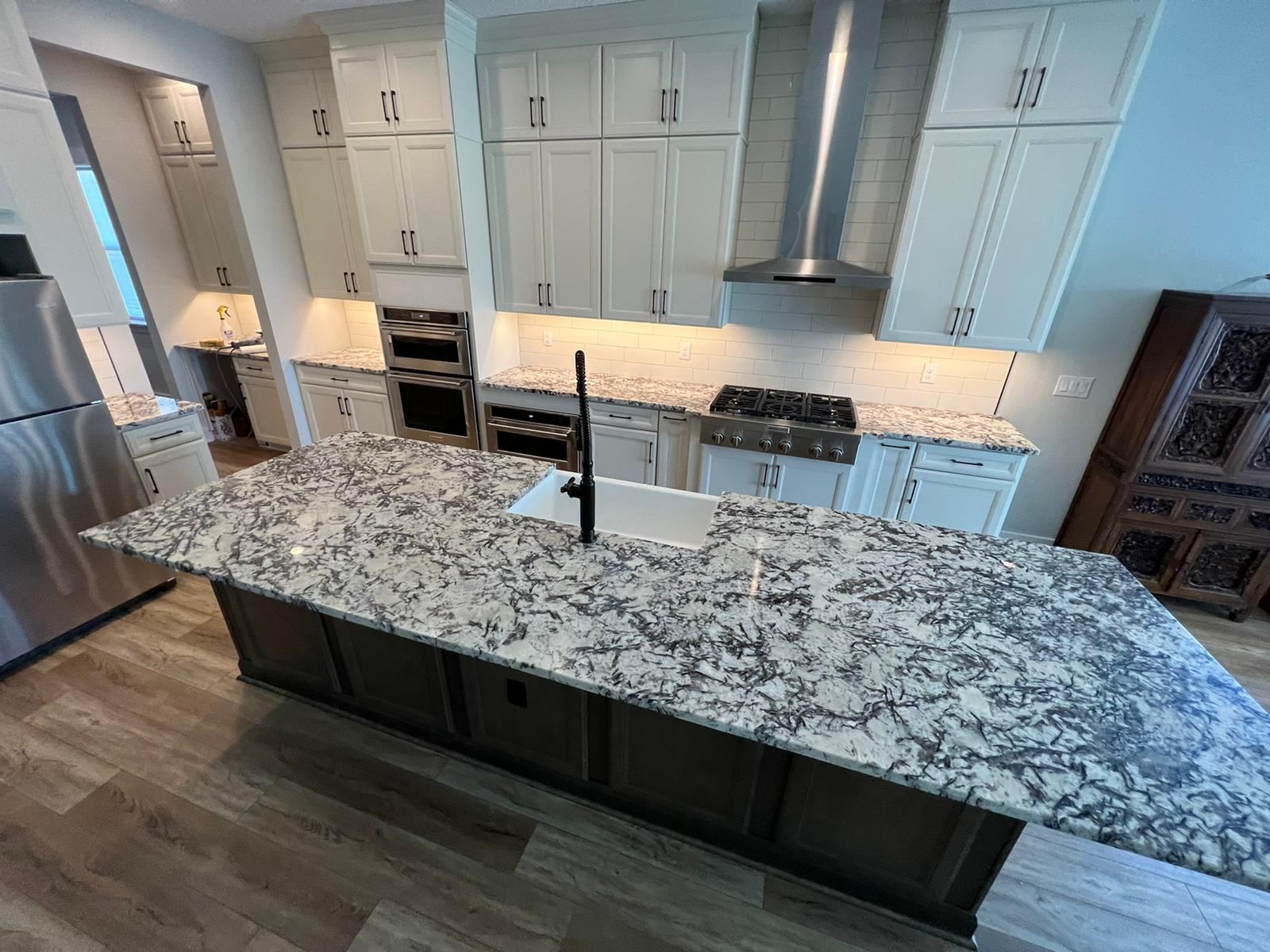 Renovated kitchen with open island layout and new countertops